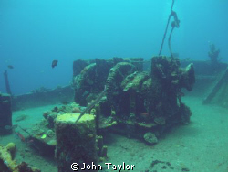 Wide-angle shot of the huge anchor winch on the bow of th... by John Taylor 